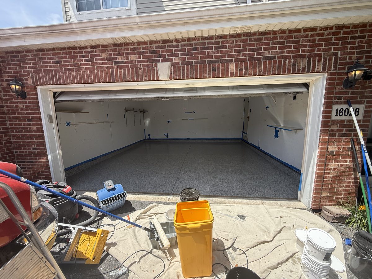 The same Lockport garage after the Signature full-flake coating — seamless gray flake floor, edge to edge
